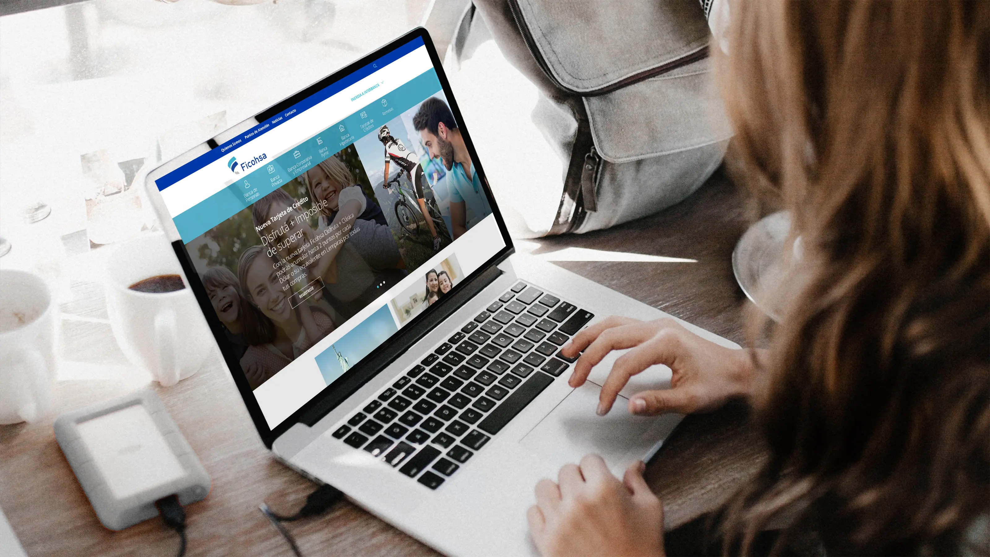 Woman using Ficohsa website on her laptop